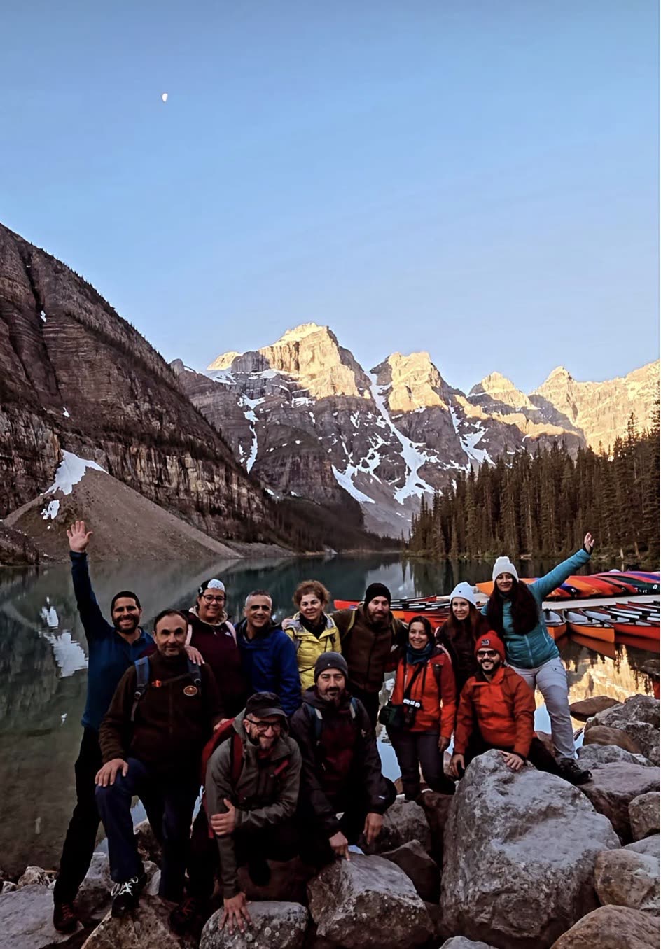 A RockFlower group together at Moraine Lake at sunrise